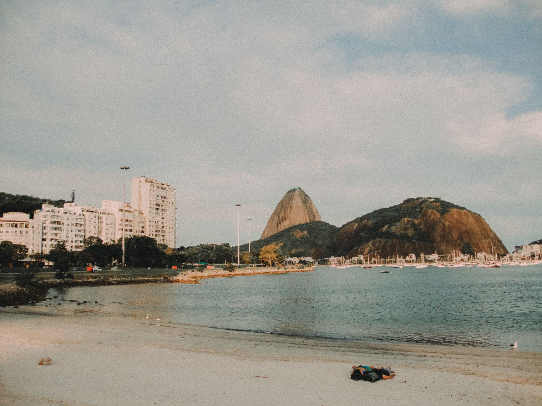 Beautiful view of Sugarloaf Mountain in Rio de Janeiro with a serene bay foreground.
